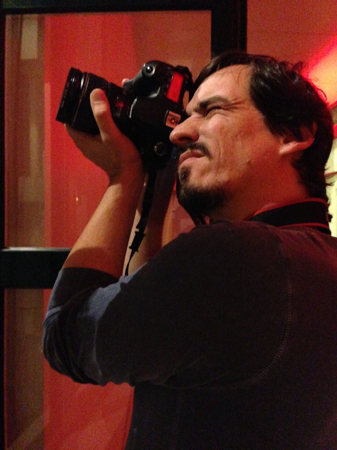 Portrait of Pedro Melo holding a camera